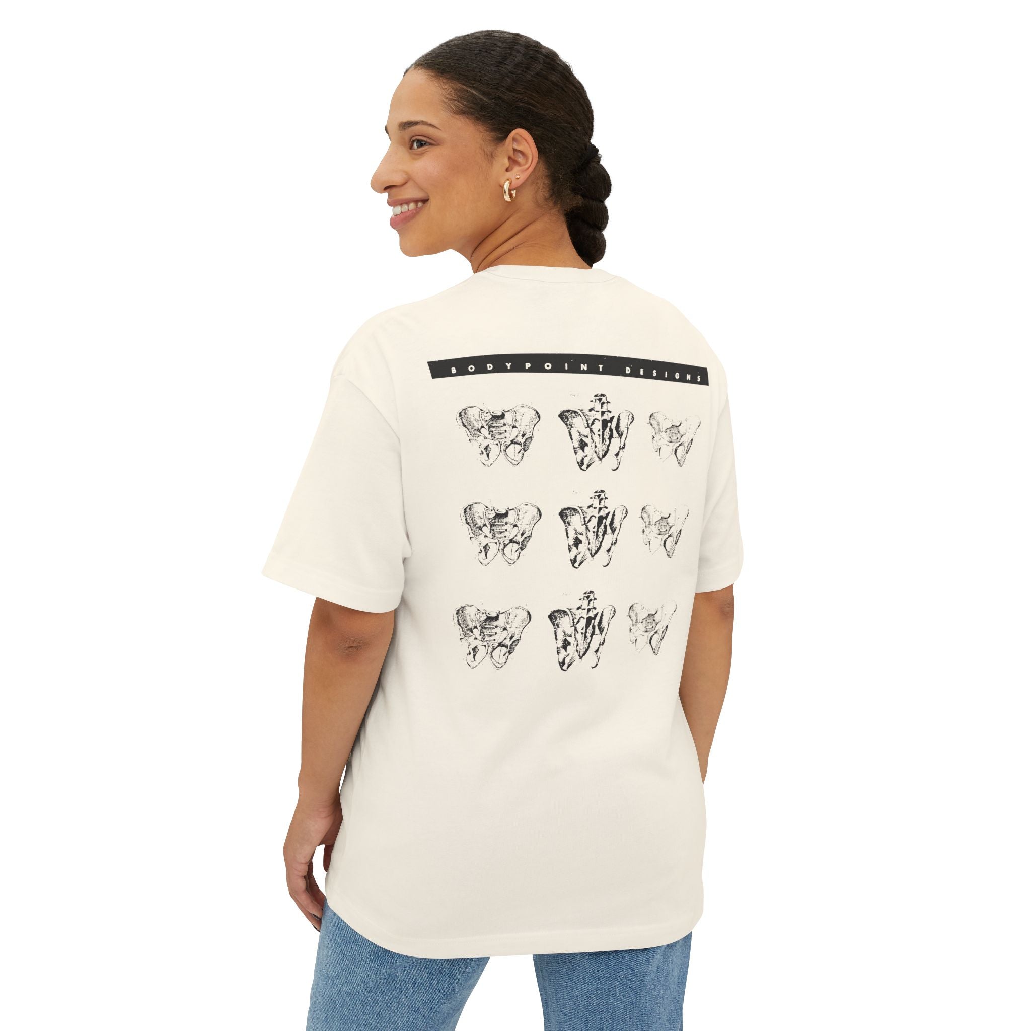 Model wearing the 1991 Tee — Unisex Boxy in cream, back view showing the 1991 archive print