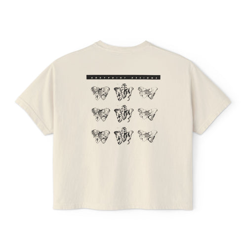 The 1991 Tee — Boxy Cropped in cream, back view: repeating grid of pelvis artwork from Bodypoint’s 1991 first catalog